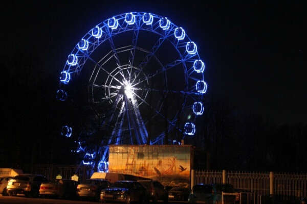 To ride a Ferris wheel at night